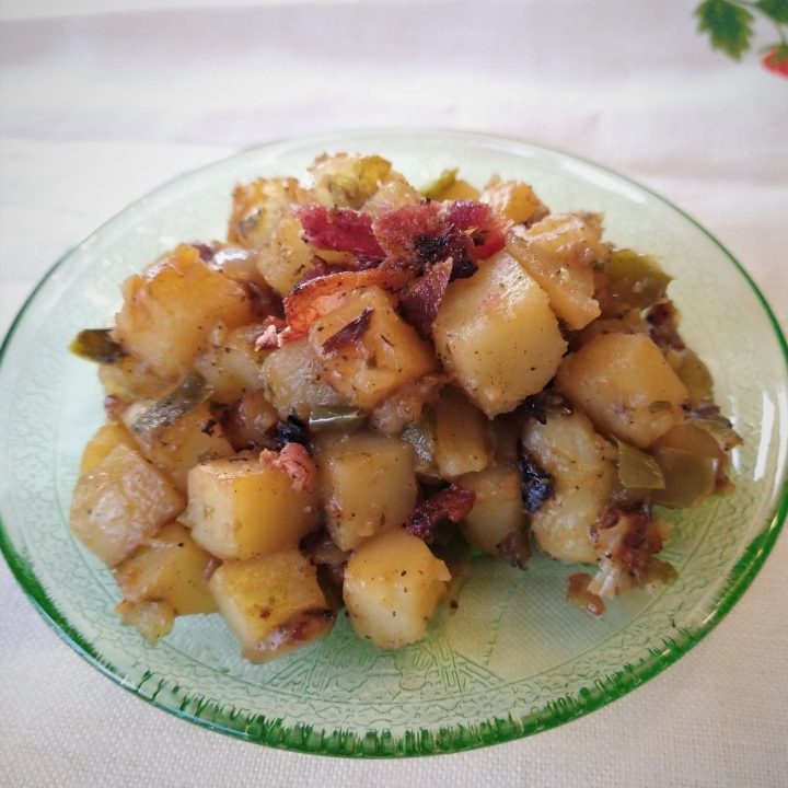 cooked potatoes on a green plate