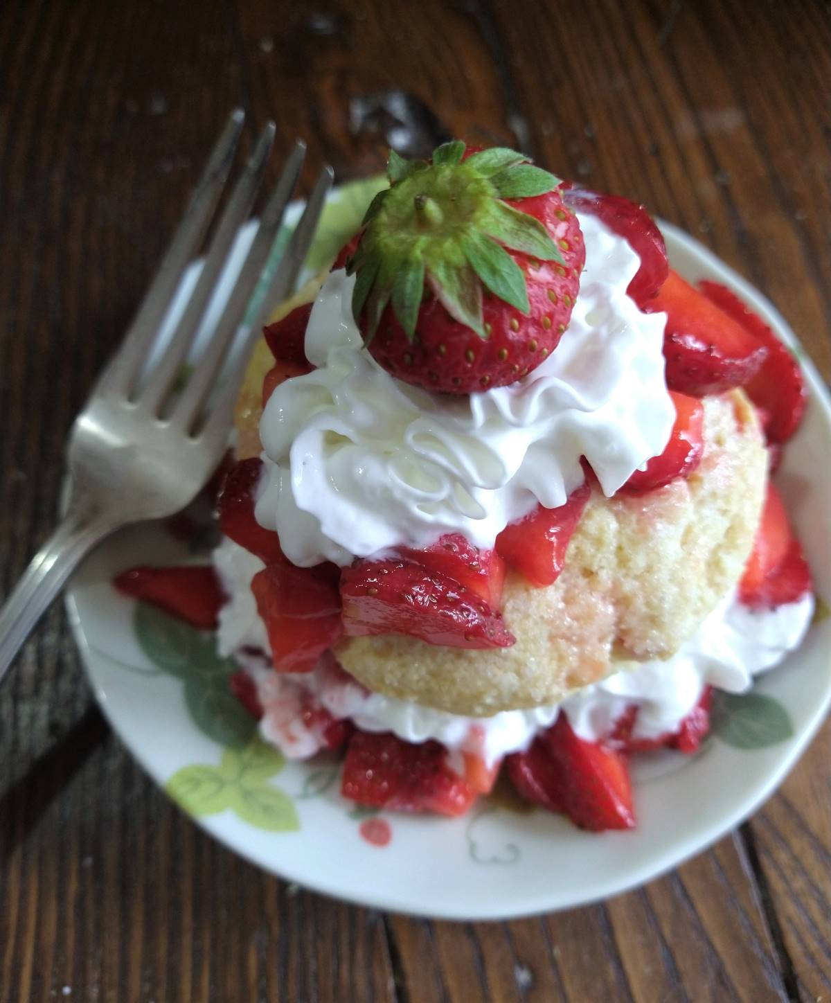 citrus strawberry shortcake on a plate with a fork