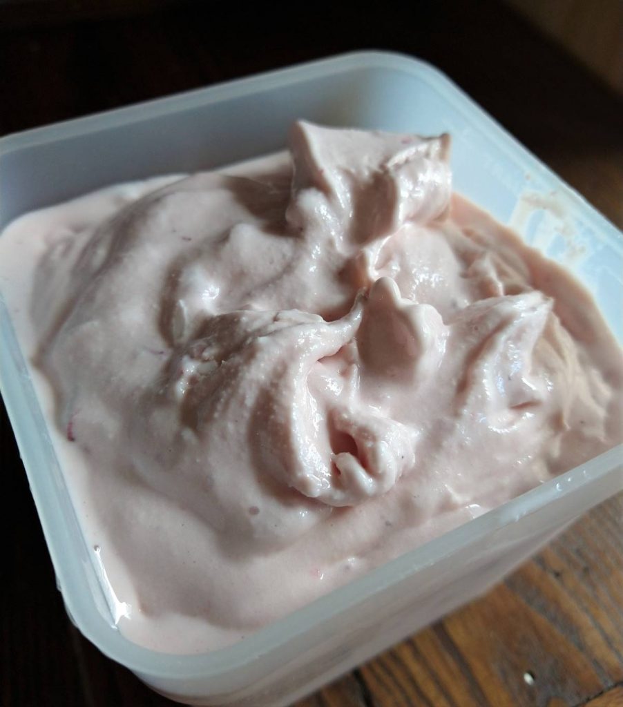 container of soft strawberry ice cream