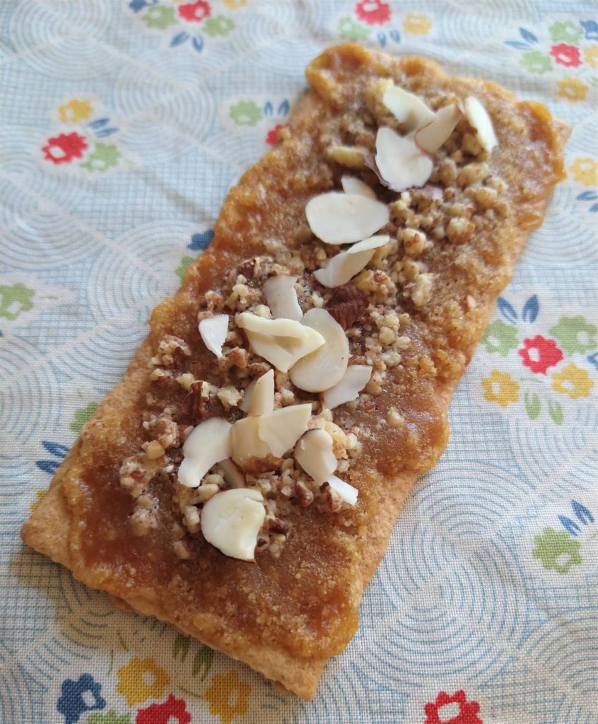 graham cracker with maple sugar and almonds on floral cloth